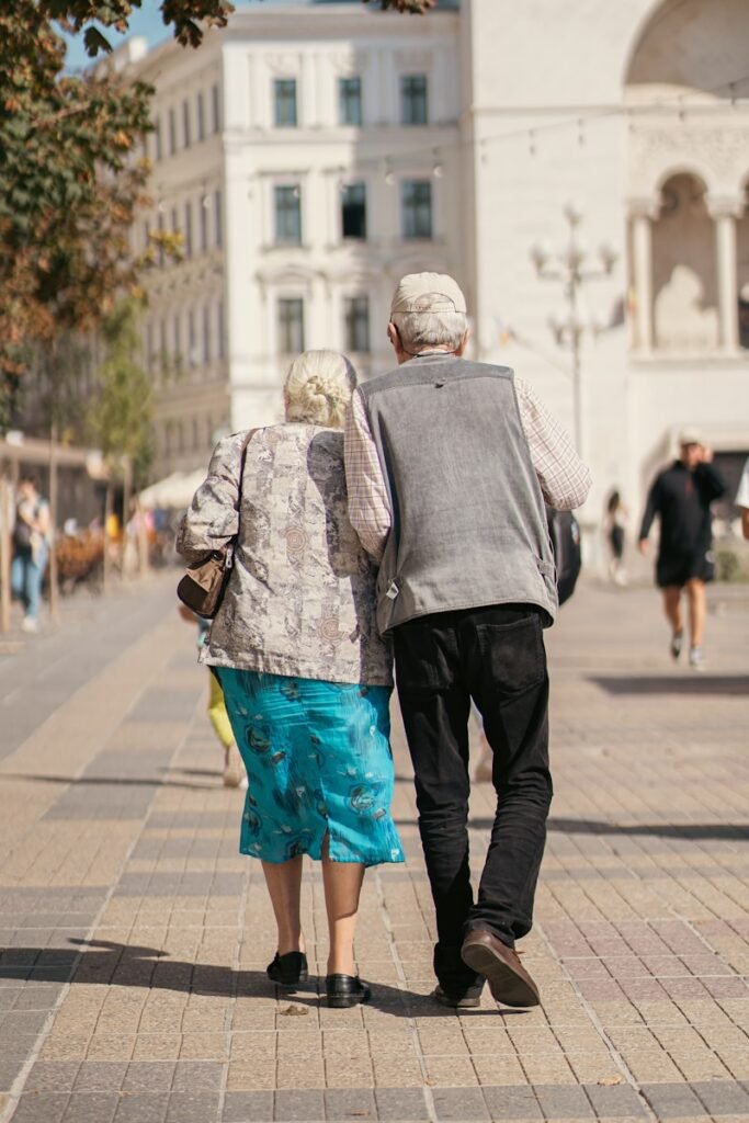 a man and a woman walking down a sidewalk